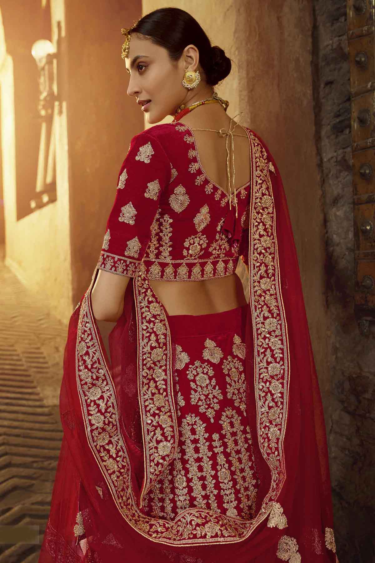 Photo of Red lehenga with unique layered border | Bridal dress design,  Indian bridal lehenga, Red lehenga