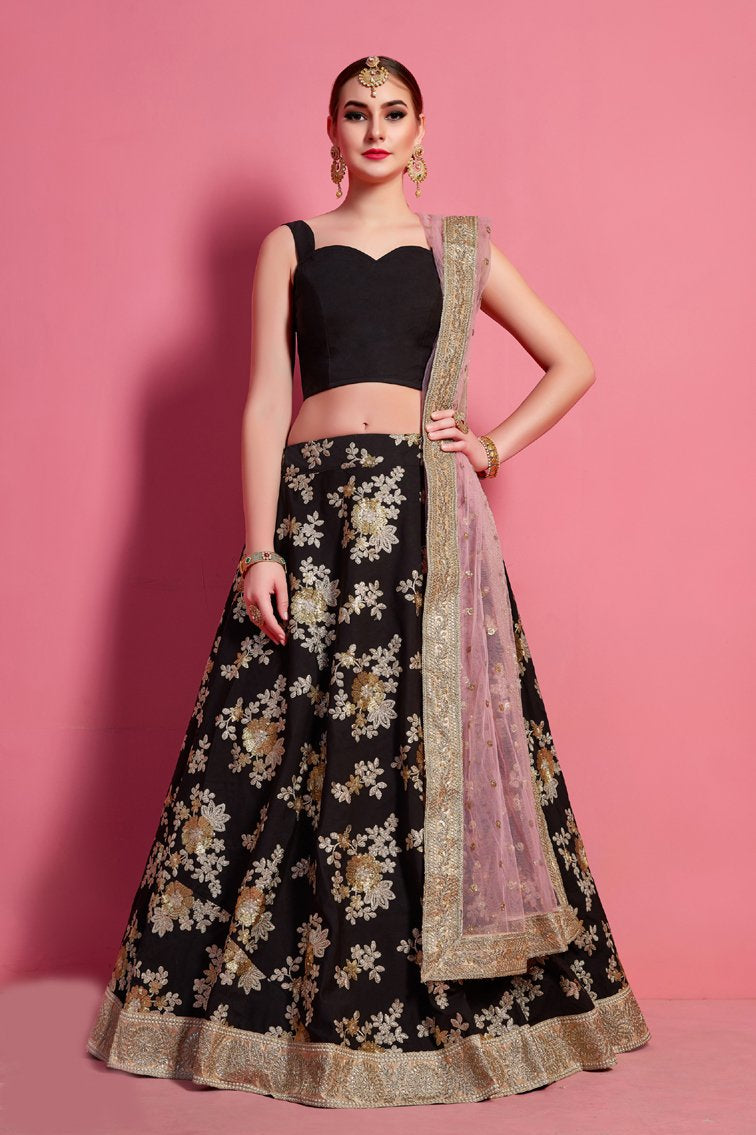 Navy blue velvet blouse matched with coral pink lehenga with attached  draped dupatta only on Kalki