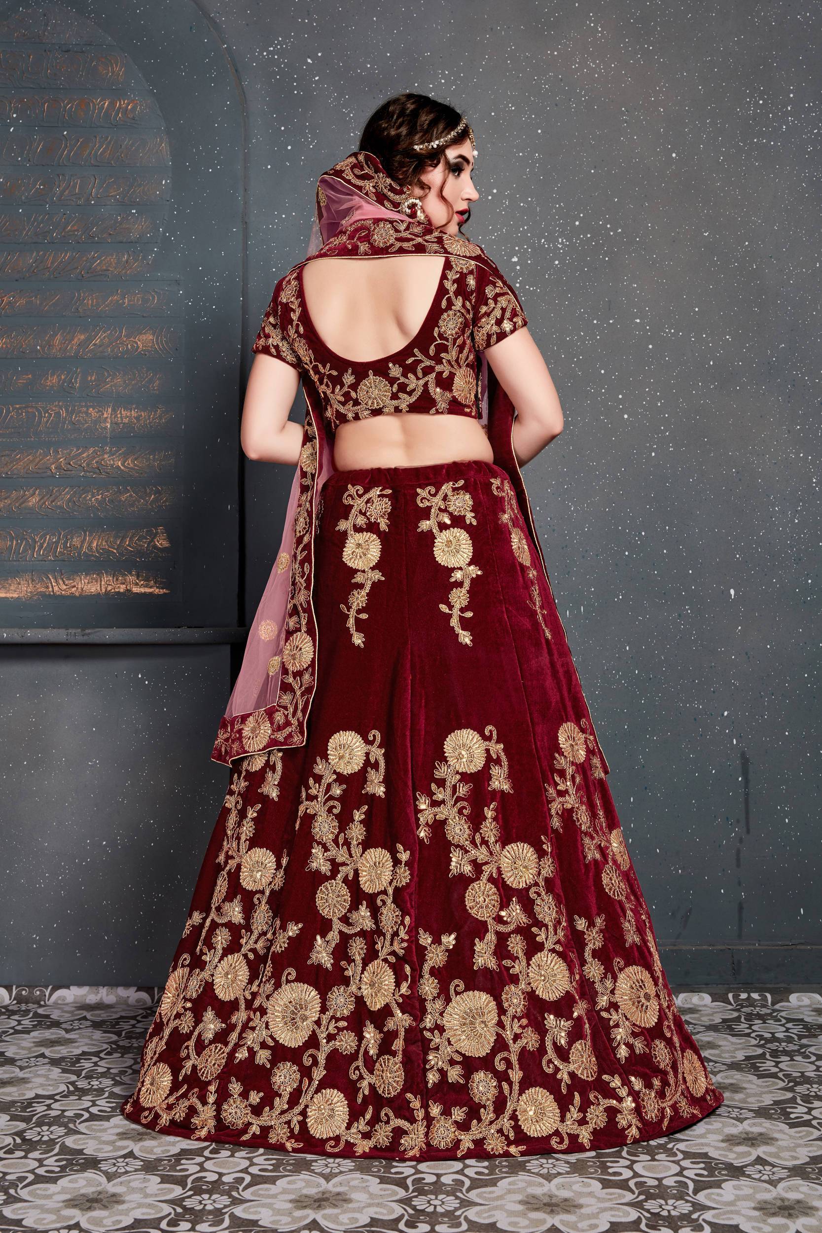 Bridal lehenga paired with maroon color heavily embellished choli and net  dupatta with heavy embroidered border. |lovelyweddingmall.com|