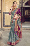 Raw Silk Party Wear Saree With Woven Work