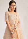 Peach Color Soft Net Fabric Stone Work Lehenga With Net Dupatta