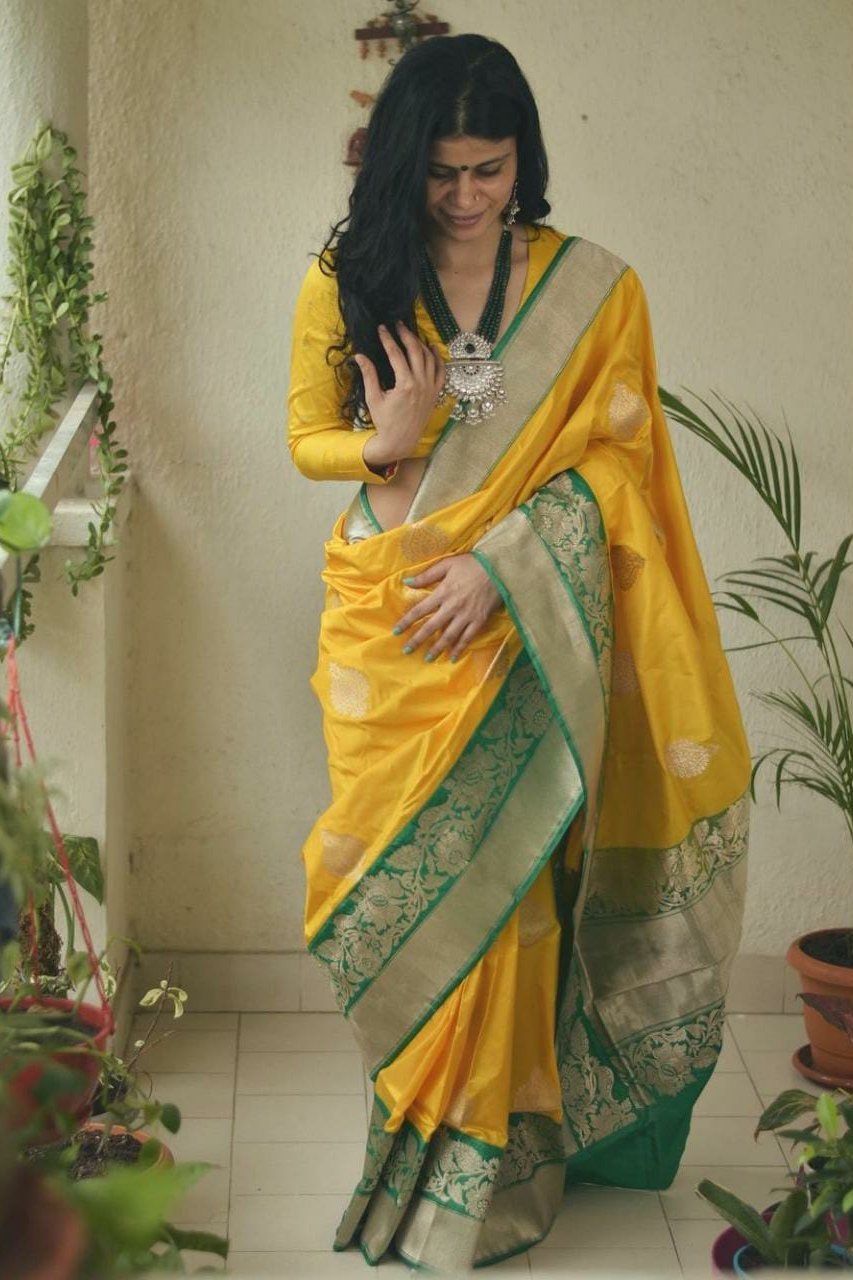 Dazzling Yellow Colored Lichi Silk Saree With Jacquard Work All Over