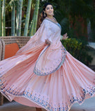 Glowing Pink Colored Partywear Embroidered Silk Lehenga Choli