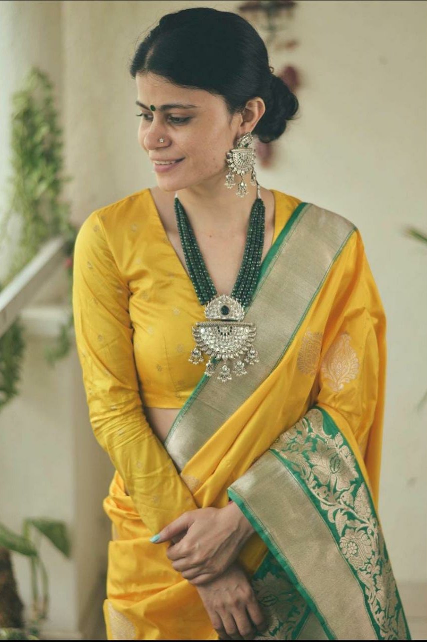 Dazzling Yellow Colored Lichi Silk Saree With Jacquard Work All Over